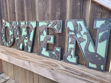 Load image into Gallery viewer, Dinosaur nursery wall decor, dino 3D layered letters, animal themed decor, nursery wall name letters, baby shower decor, baby shower name sign, gift for kids, new baby gift