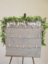 Load image into Gallery viewer, Weathered grey your seat awaits. Hand painted plywood seating chart sign. Beach themed wedding decor.