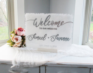 white and silver acrylic wedding welcome sign
